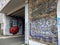 Street art of a muscular man`s bust with a red intestine outside to Rome in Italy.