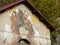 Street art of two boys faces of a facade of a building to Rome in Italy.