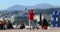 Street artist making large soap bubbles with beautiful nice city panorama in the background