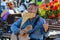 A street artist playing guitar and mouth organ music, san Fransisco