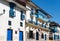 Street with Blue Windows, Shutters and Balconies in Cusco, Peru