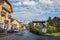 Street with cars and shops in the district of Le Fayet