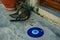 A street cat in Turkey lying near the sign of the region of Turkey.