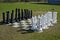 Street chess in the lawn. Large chessboard with high chess pieces standed on their places