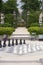 Street chessboard with black and white chessmen in the summer day in park