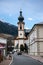 A street with a church in a small town in the Austrian mountains.