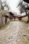 Street with cobble stones of folk museum Zheravna village in Bulgaria