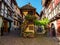 Street with colorful traditional french houses in Eguisheim, France