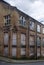 Street corner view of closed and boarded up old abandoned industrial and office buildings in the little germany area of bradford