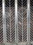 Street curly herringbone metal fence with geometric pattern
