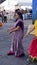 Street dancer hippie girl with striped dress