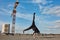 Street dancer hipster guy makes back flip with arm support on the roof outdoor.