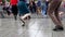 Street dancers legs perform dance step on street pavement. Street music day.