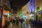 Street decorated with Christmas lights at night