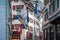 Street decorated with Swiss flags. Narrow street in center of Zurich, Switzerland.