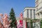 Street decoration on Easter Moscow Easter Holidays. Blooming sakura, Fir tree with eggs and colorful carousel