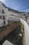 Street with dwellings built into rock overhangs. Setenil de las Bodegas, Cadiz, Spain