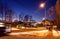 A street in the evening in winter with bus stops