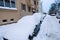 A street with extremely snowy cars