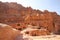 Street of Facades, which is caves with doors carved out of the red stone, Petra, Jordan