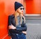 Street fashion concept - stylish woman in rock black style