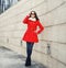 Street fashion, stylish woman in red jacket