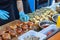 Street fast food. Cooks prepare different burgers in outdoors cafe.