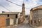 Street in Ferreruela de Huerva town and the Virgen de la Asuncion church, province of Teruel, Aragon, Spain