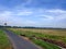 Street, fields, and blue sky is beautifull view