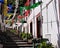 A street with a flight of steps decorated with colored paper flowers for a traditional festival in Sao Vicente Madeira, Portugal