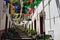 A street with a flight of steps decorated with colored paper flowers for a traditional festival in Sao Vicente Madeira, Portugal