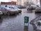 A street flooded with meltwater with stuck cars flooded the Parking lot in the spring