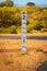 Street floodway depth indicator next to Australian Outback road