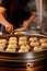 Street food booth selling Chinese specialty Steamed Dumplings in Beijing, China