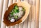 Street food noodles In a tile bowl on the Asian wood floor