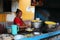 Street food vendor engaged in her job in the busy streets