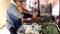 A street food vendor prepares deep fried Chinese chive dumpling