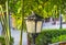 Street forged metal lanterns on on a well-groomed cottage with g