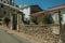 Street in front of charming old house at Monsanto