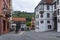 Street in the Gemany town Fussen with Benediktinerkloster St.Mang to the right and Church of the Holy Spirit in the middle