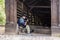 The street guitar player plays the guitar near the entrance to the tunnel, leading to the old town of Sighisoara in Romania