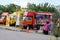 Street hawkers using food trucks to serve their business to the customer.