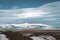 Street Highway Ring road No.1 in Iceland, with view towards massive glacier with beautiful lenticular clouds. Southern