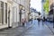 Street with historical buildings and motion blur pedestrians