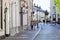 Street with historical buildings and motion blur pedestrians