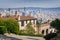 Street and houses in the residential area of San Francisco; downtown city views in the background, California