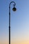 Street lamp against the blue sky in the early sunny morning