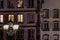 Street lamp and buildings with highlighted windows, night view of Strasbourg