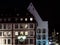 Street lamp and buildings with highlighted windows, night view of Strasbourg