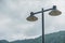 Street lamp on cloudy daylight.